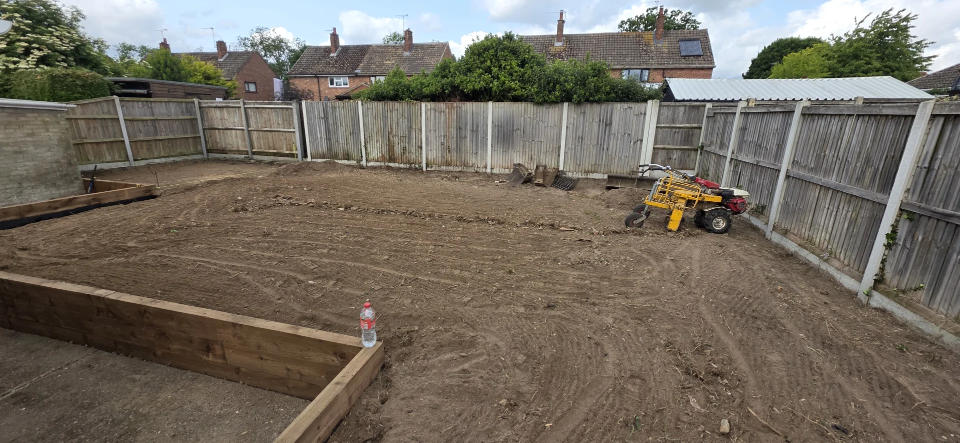 Before: uneven ground needing rotavating